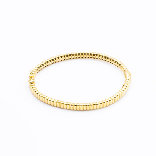 Bangle in 18K gold.